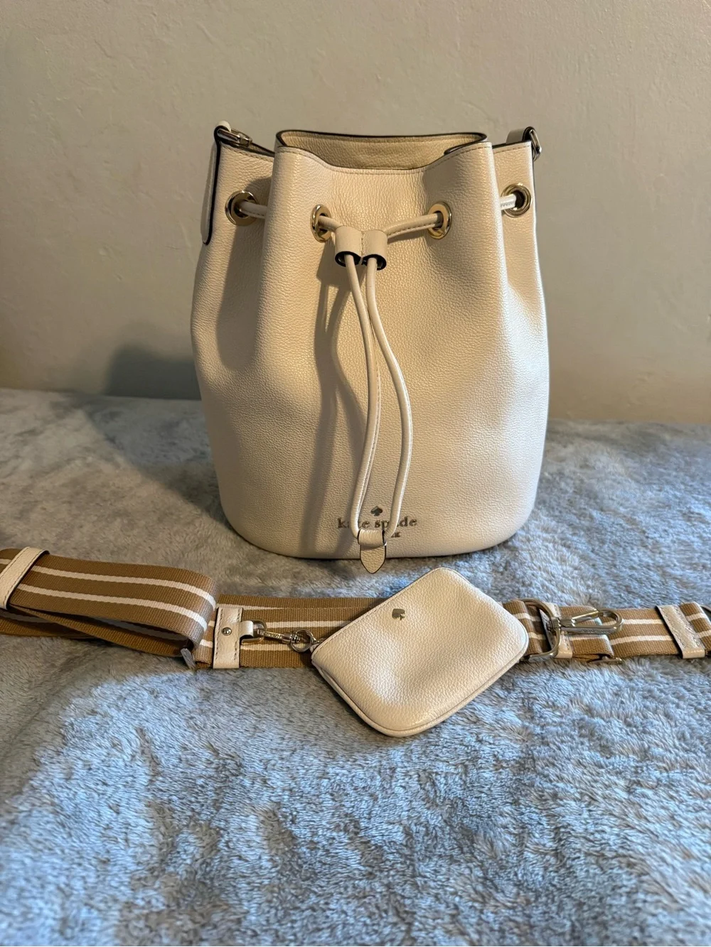 kate spade Cream Pebble Leather Drawstring Bucket Bag with Striped Strap